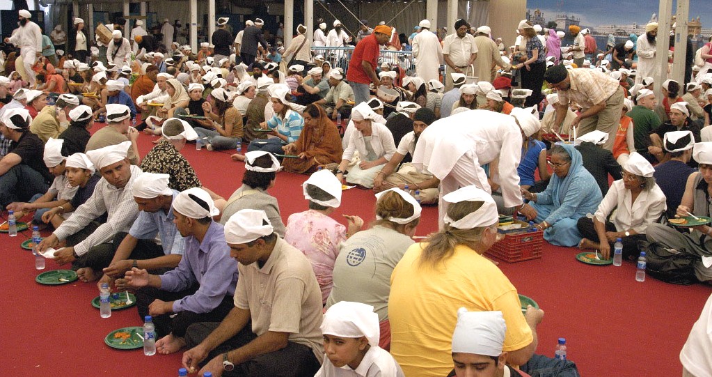 People sharing a community langar meal